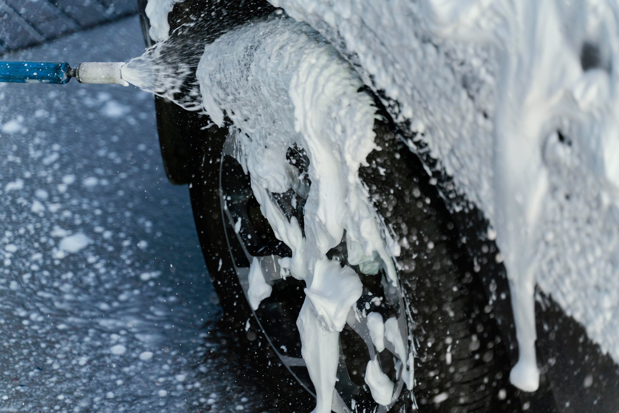 woman-washing-her-car-outdoors woman-washing-her-car-outdoors